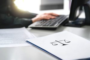 Attorney with computer and paperwork